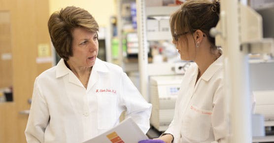 Eileen Dolan, PhD, and colleague in lab
