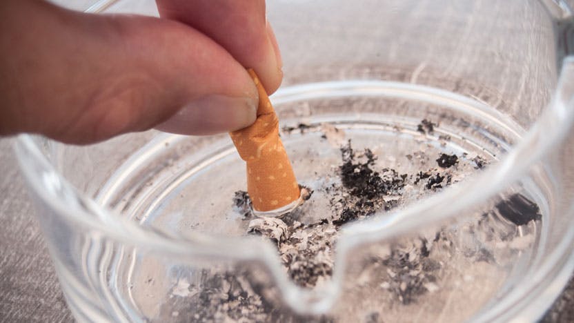 A cigarette being put out in an ashtray