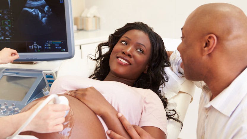 Pregnant woman and partner during ultrasound