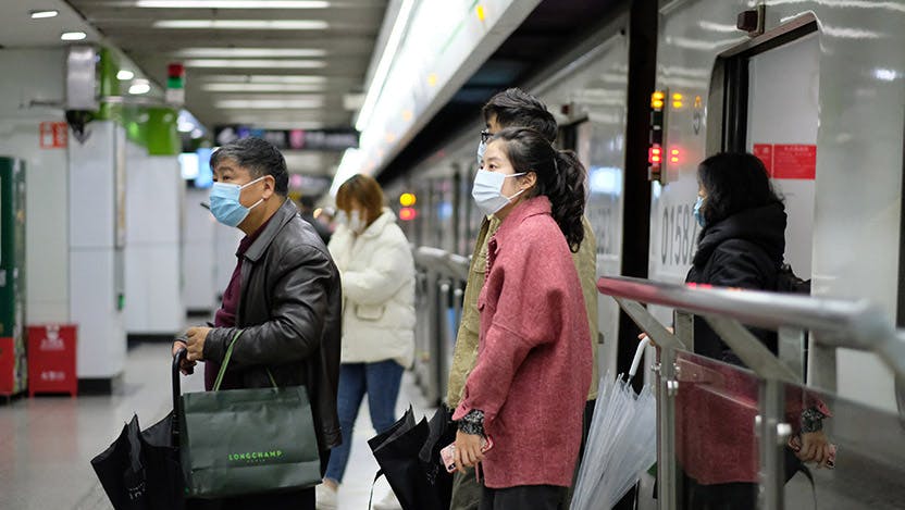 Travelers wearing face masks