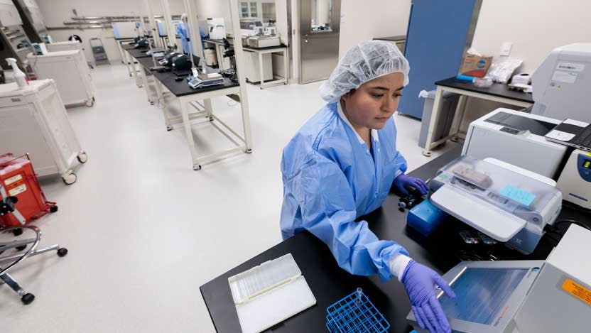 lab tech working in Advanced Cellular Therapeutics Facility (ACTF)