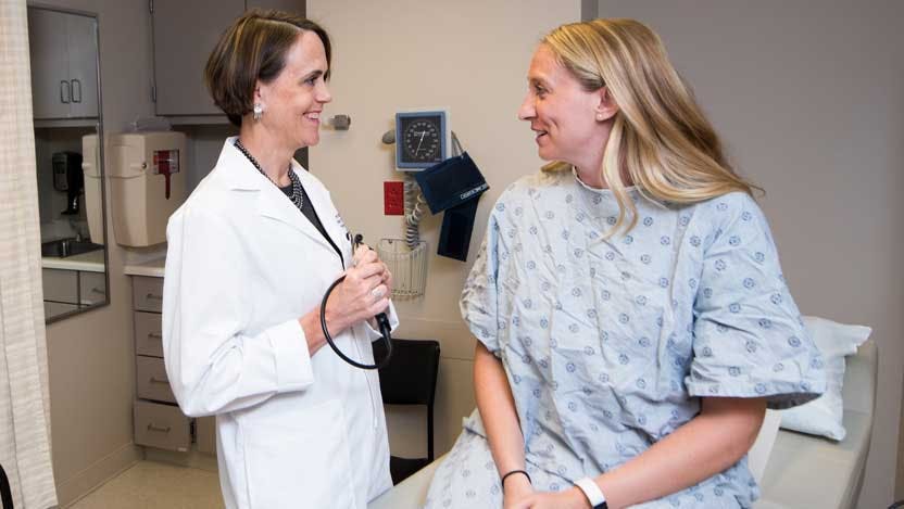 Jessica Donington, MD, and patient in DCAM clinic