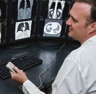 Radiologist Christopher Straus, MD, reviews radiology images