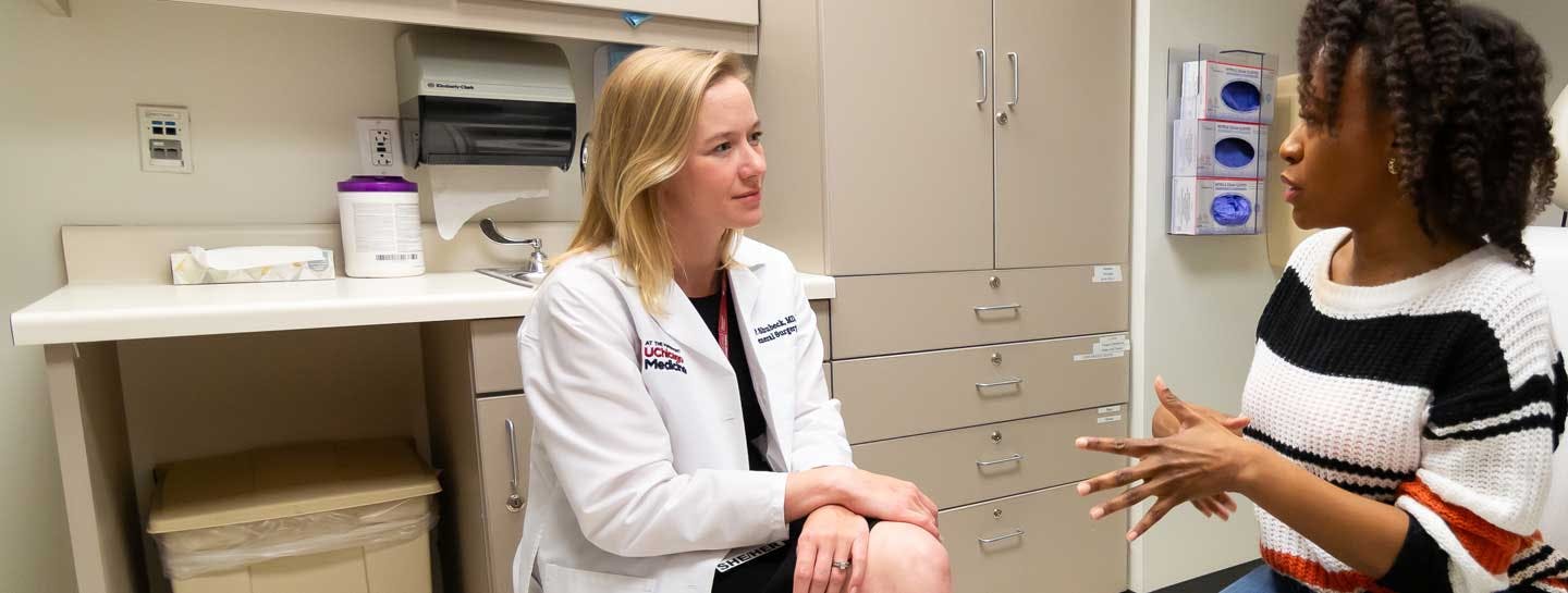 Breast surgeon Sarah Shubeck, MD, and patient, in clinic