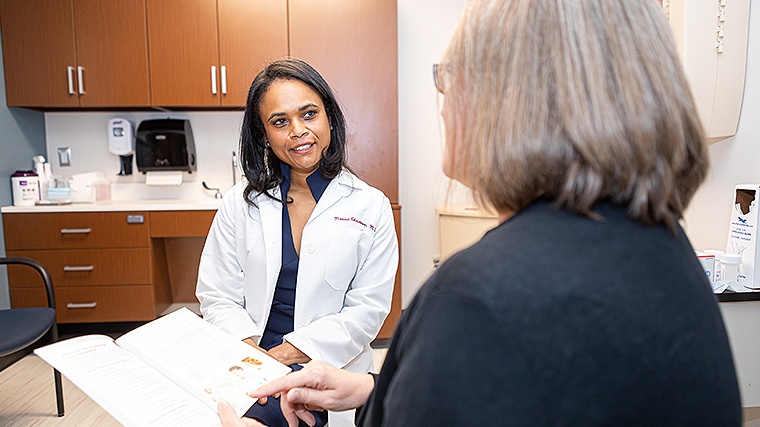 Gynecologist Monica Christmas, MD, in discussion with a patient