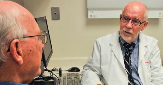 Andrzej Jakubowiak, MD, PhD, and patient in DCAM clinic