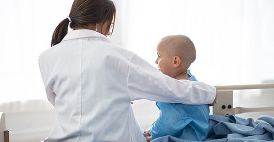 Image of doctor talking to pediatric leukemia patient